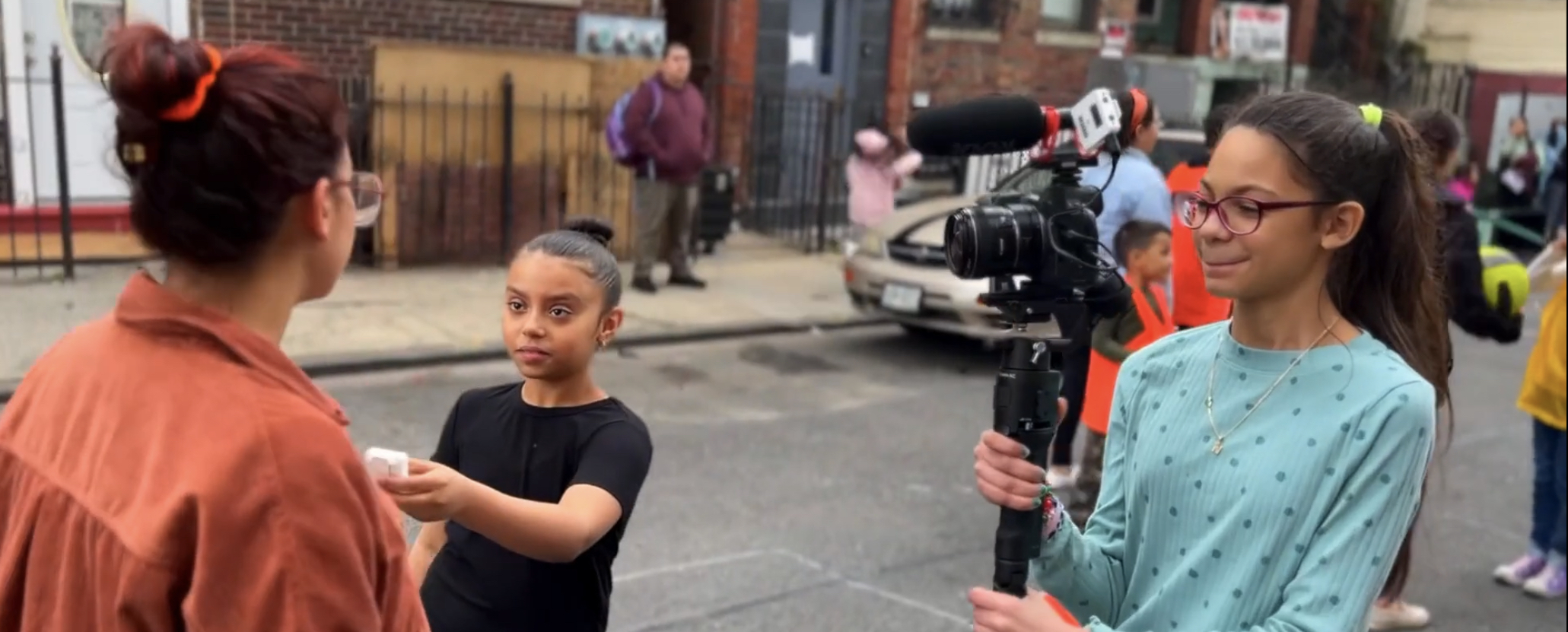 students filming an interview in the streets